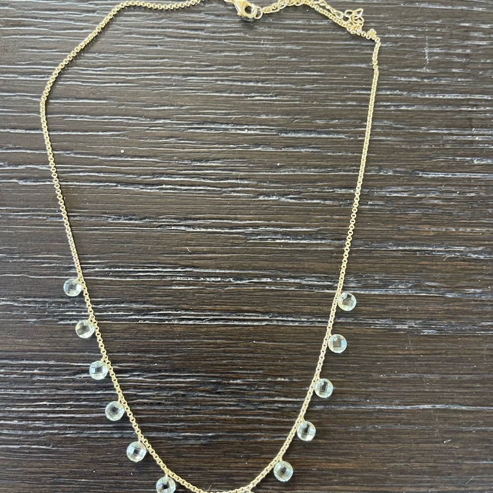 Dainty gold necklace with crystals. Look light blue in light
